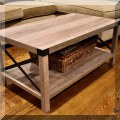 F64. Coffee table with metal end braces. 18"h x 40"w x 22"d 